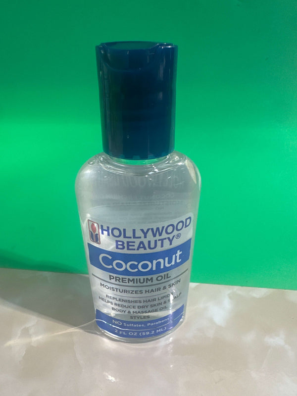 Bottle of Hollywood Beauty Coconut Premium Oil on a green background